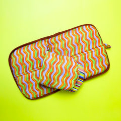 Modern sustainable kitchen duo featuring organic cotton mitt and pot holder in bold colorful design
