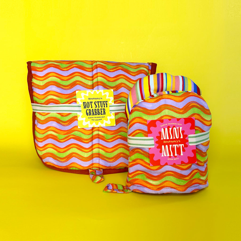Sustainable kitchen bundle featuring coordinated organic cotton mitt and pot holder with vibrant prints