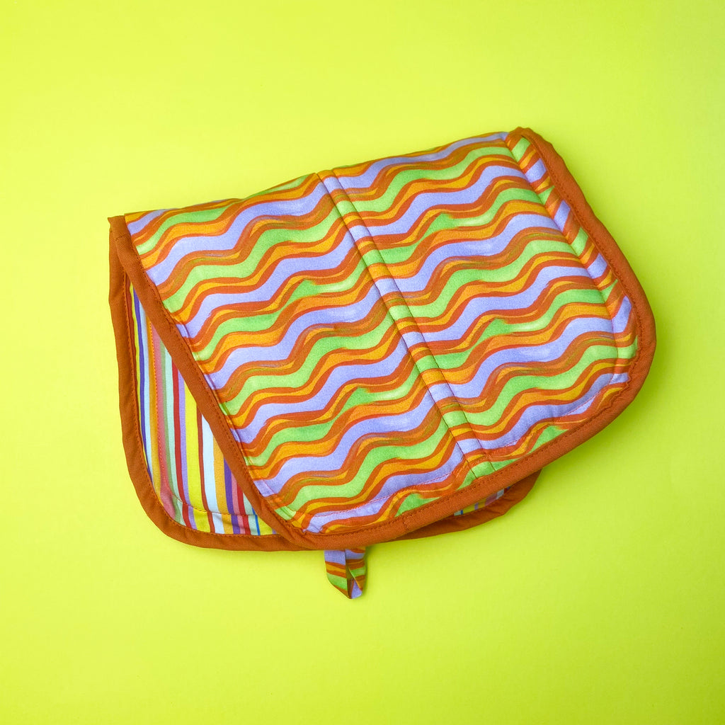 Colorful sustainable pot holder made with water-saving printed organic cotton